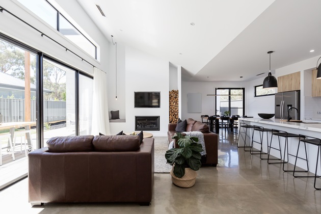 Sleek polished concrete flooring in a modern open-plan living room